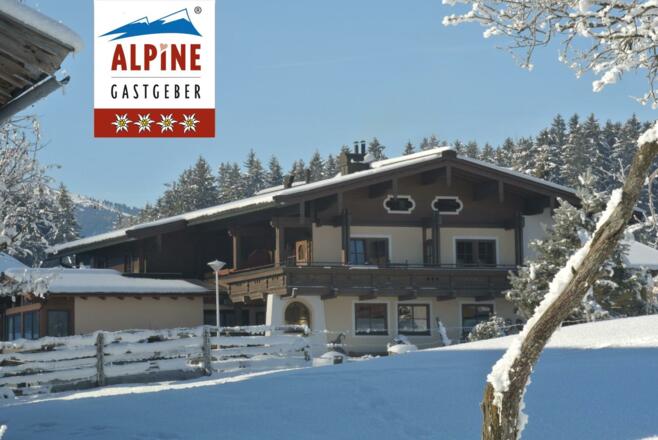 Hausfoto Winter mit AG Logo