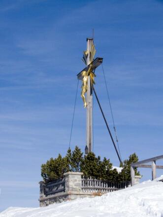 Das goldene Gipfelkreuz