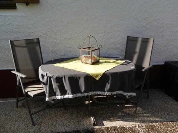 Ferienwohnung Aschauer mit Sitzmöglichkeit im Garten
