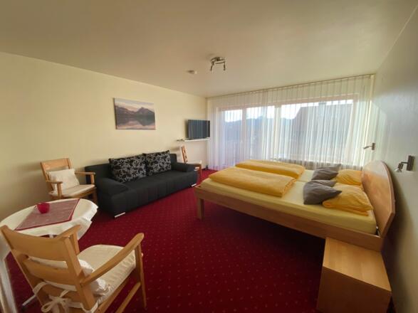 Sonne-FEWO - Schlafzimmer mit Schlafsofa