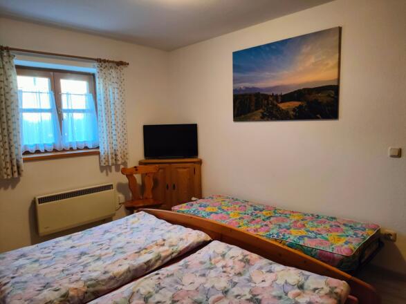das Schlafzimmer mit Zustellbett