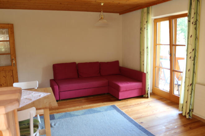 Sitzecke und Balkon in der Ferienwohnung Johanna